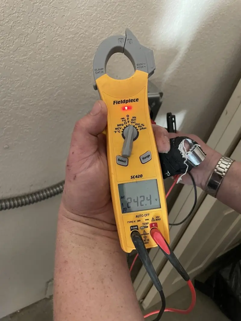 Voltage testing with clamp meter during Generator Installation in Wenham